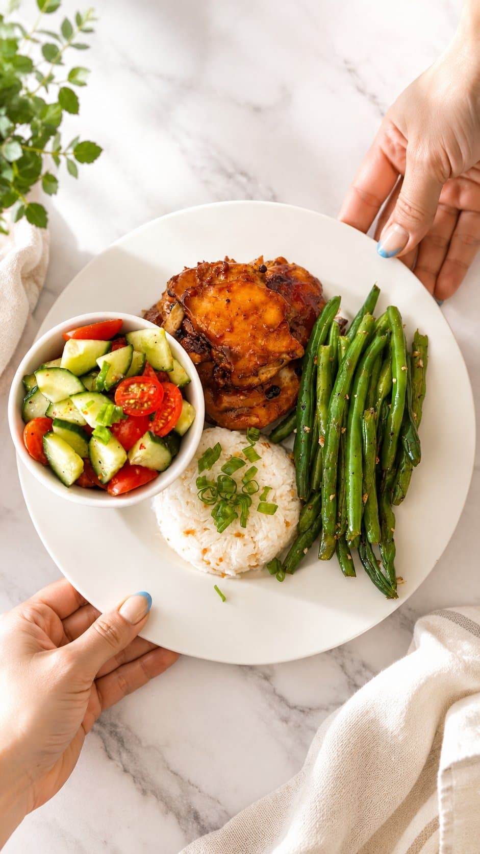 Teriyaki glazed chicken with garlic rice, blistered green beans, and cucumber-tomato salad