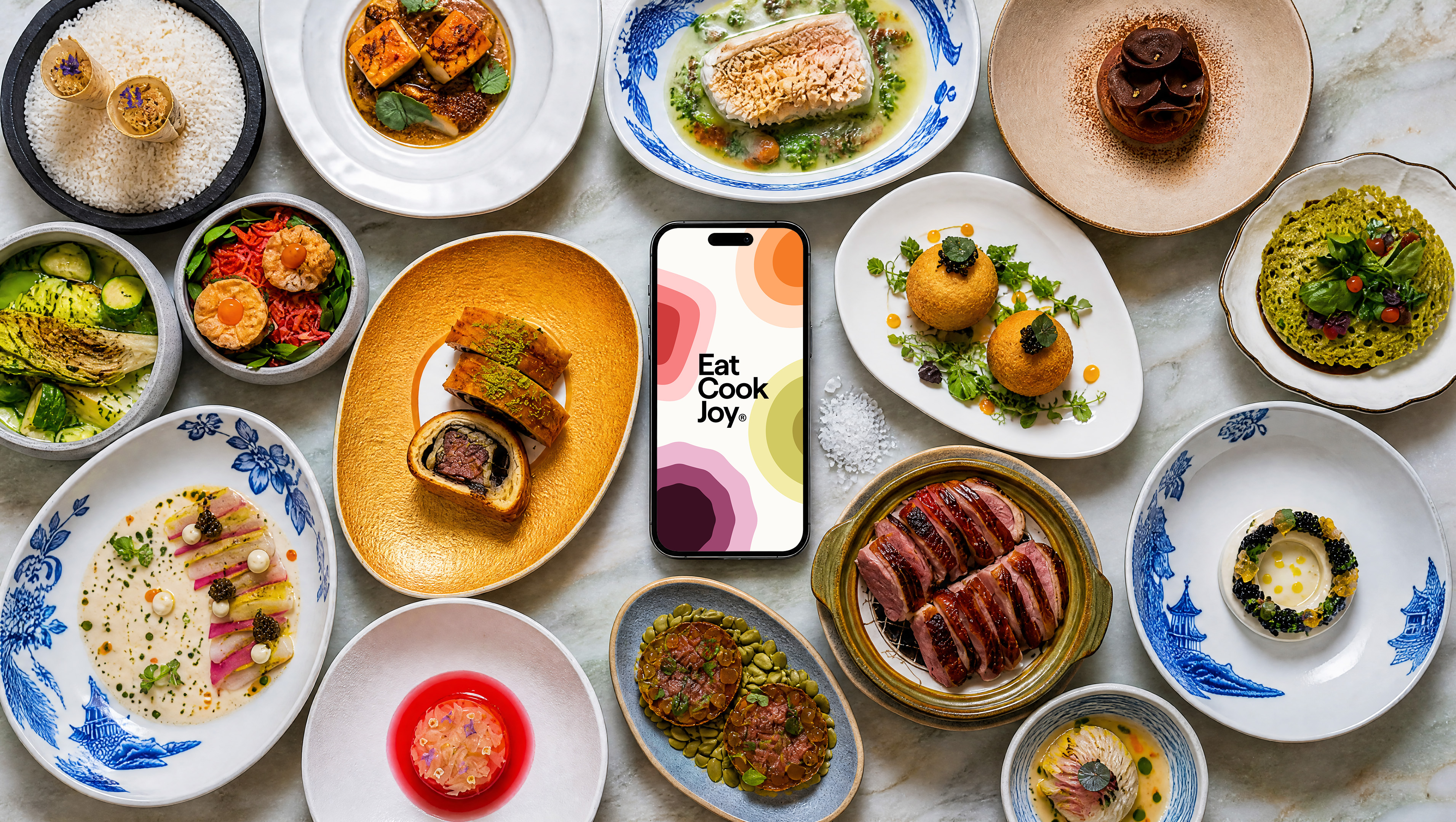 Eat Cook Joy app on a table with food